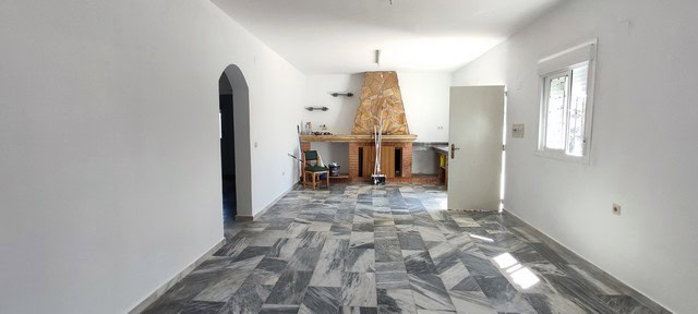Interior view of rural property in Macael, Almeria with spacious living area and fireplace.