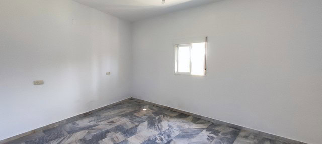 Interior of rural property in Macael, Almeria with white walls and natural light.