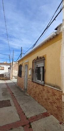 Charming village house in Purchena, Almeria, with traditional architecture and vibrant surroundings.