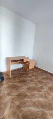 Charming village property with simple furnishings in Purchena, Almeria, featuring a small wooden des.