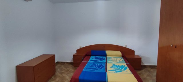 Cozy bedroom in a village property located in Purchena, Almeria, featuring simple furnishings and a.