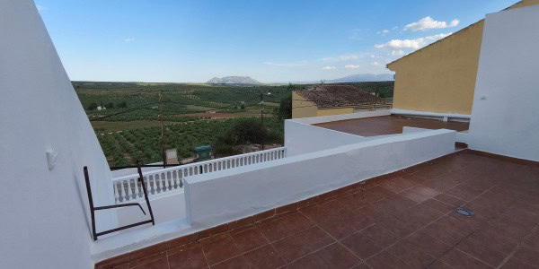 Terrace view from village property in Fontanar, Jaen, with scenic countryside and mountain backdrop.