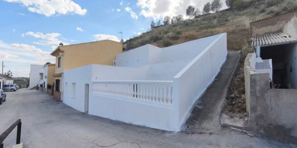 Village property for sale in Fontanar, Jaen with scenic hillside views.