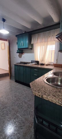 Charming village home kitchen in Somontin, Almeria with traditional decor and modern amenities.