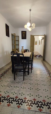 Interior view of a traditional village property in Somontin, Almeria, featuring a dining area with v.