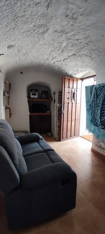 Charming cave house with rustic interior in Villanueva de las To, Granada, perfect for unique living.