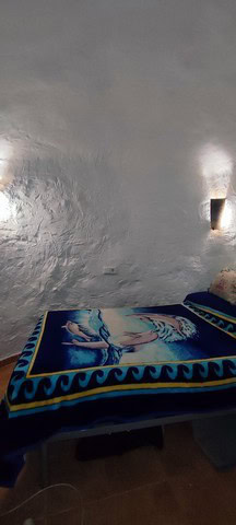 Unique cave house interior in Villanueva de las To, Granada, showcasing traditional architecture.
