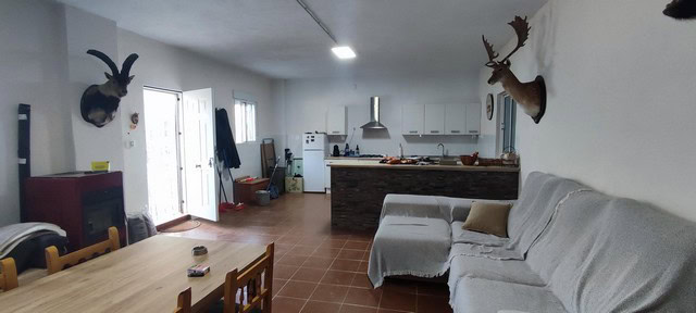 Interior view of a rural property in Villanueva de las To, Granada, showcasing a spacious living are.
