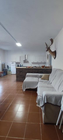 Rural property in Villanueva de las To, Granada, featuring a spacious living area and open kitchen.