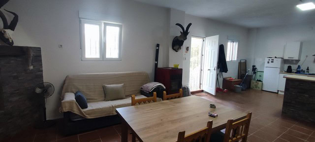 Charming rural home interior in Villanueva de las To, Granada, featuring a spacious living area and.
