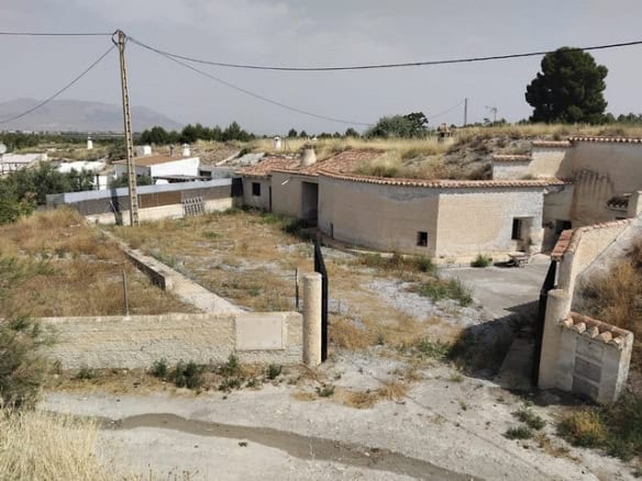 Cave house in Cantarranas, Granada, with traditional architecture and scenic surroundings.