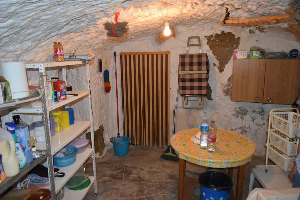 Unique cave house interior in Caniles, Granada, showcasing rustic charm and traditional living space.