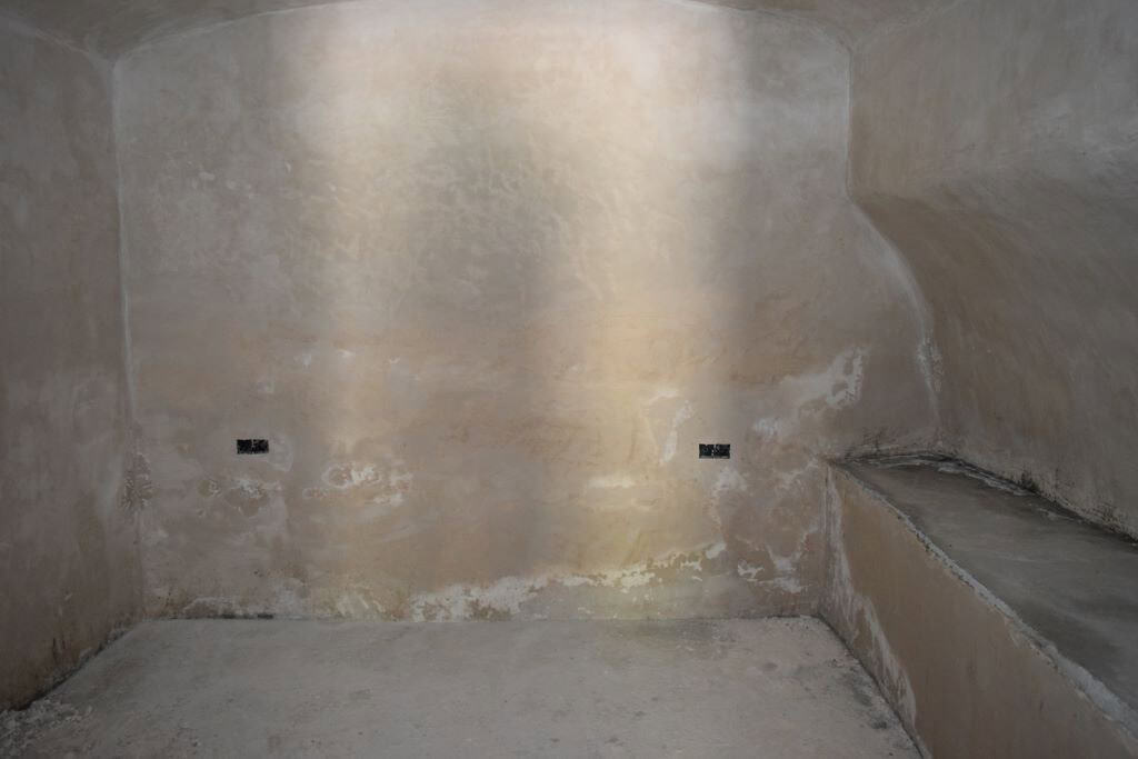 Interior view of a rustic cave house in Caniles, Granada, showcasing natural stone walls and unique.