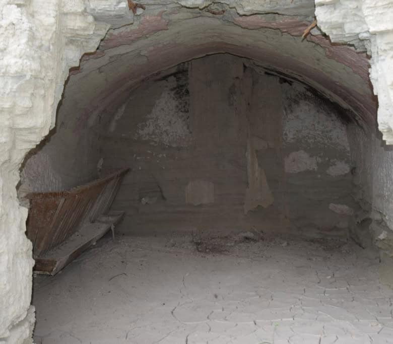 Cave house interior in Benamaurel, Granada, showcasing traditional underground living space.