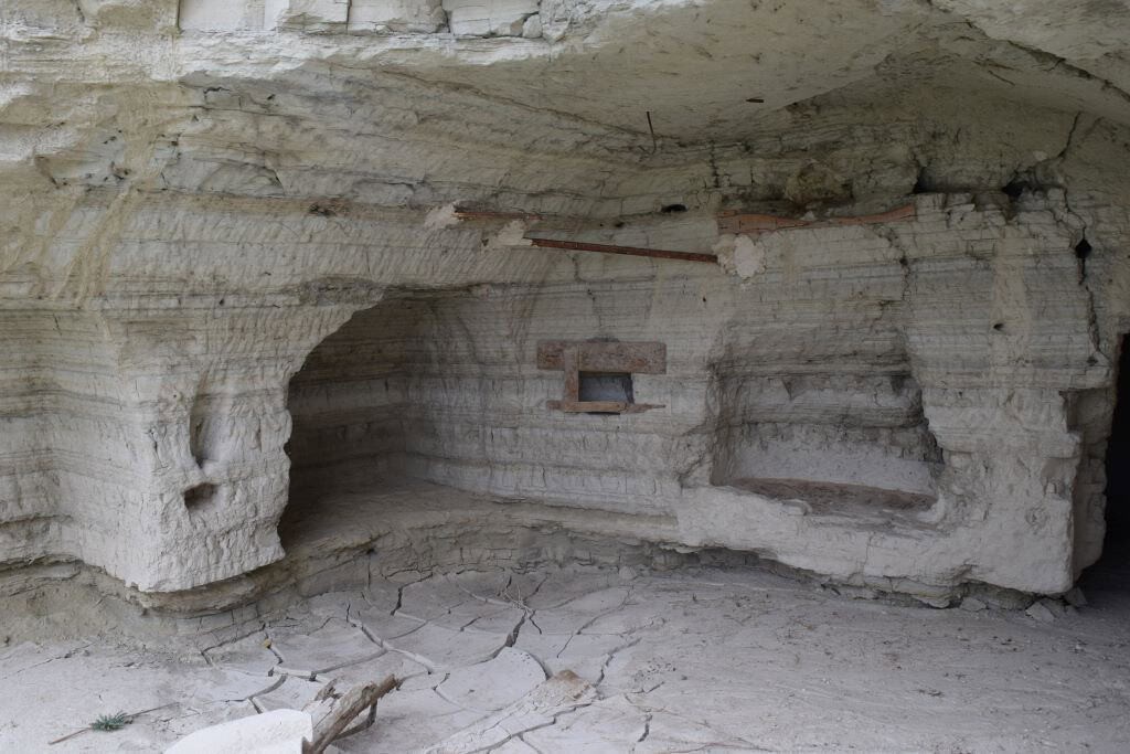 Cave house interior in Benamaurel, Granada, showcasing natural rock walls and unique architecture.
