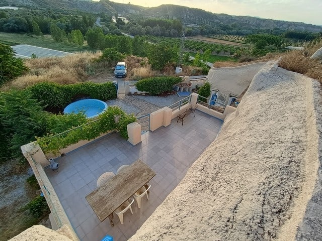 Charming cave house with outdoor terrace and scenic mountain views in Cortes de Baza, Granada.