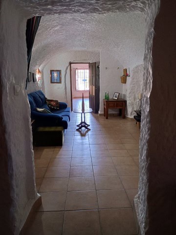 Unique cave house interior in Cortes de Baza, Granada, featuring rustic decor and cozy living space.