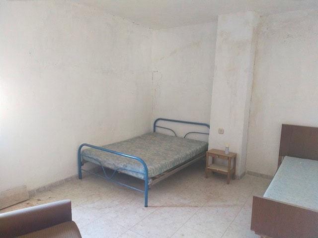 Village property bedroom in Somontin, Almeria with basic furnishings and simple interior.