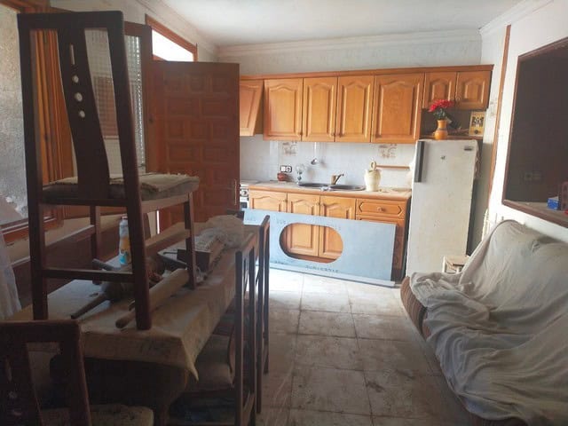 Charming village home with kitchen, living area, and outdoor space in Somontin, Almeria. Ideal for a.
