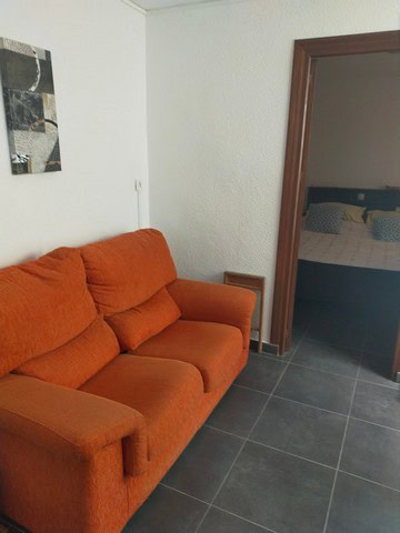 Village Property in Urracal, Almeria with cozy living room and bedroom access.