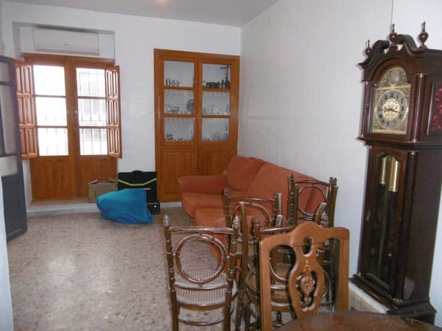 Charming village property in Urracal, Almeria, featuring a cozy living room with traditional furnitu.