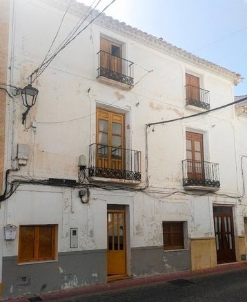 Charming town house in Velez Blanco, Almeria, featuring traditional architecture and balconies.