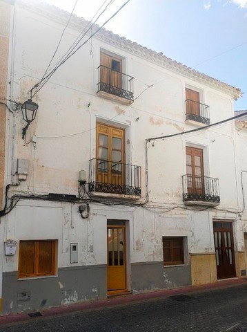 Charming town house in Velez Blanco, Almeria, featuring traditional architecture and balconies.