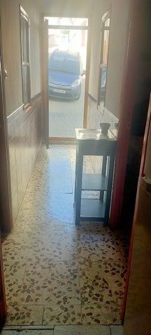 Charming entrance of a town house in Velez Blanco, Almeria, showing a view of the street and parked.