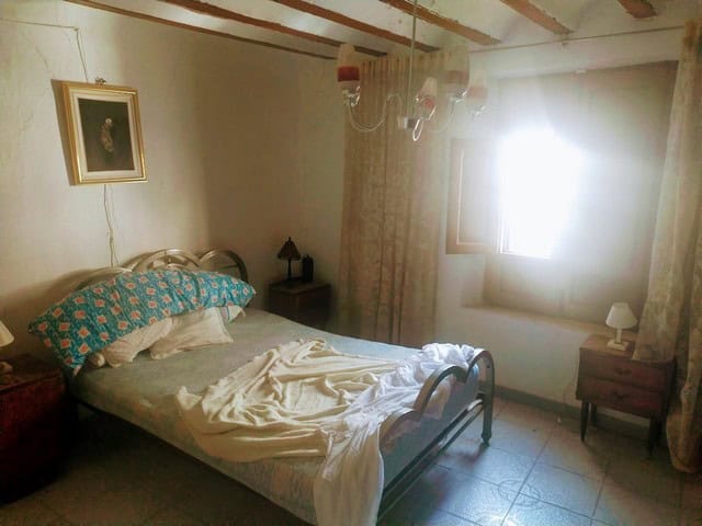Charming bedroom in a town house located in Velez Blanco, Almeria, featuring natural light and cozy.