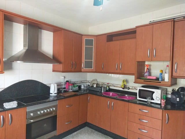 Charming kitchen in a villa located in Hijate, Almeria, featuring modern appliances and wooden cabin.