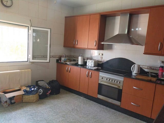 Cozy kitchen in a villa located in Hijate, Almeria, featuring wooden cabinets, modern appliances, an.