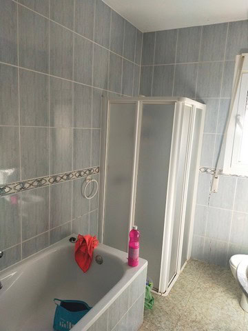 Bathroom with bathtub and shower enclosure in Hijate, Almeria.