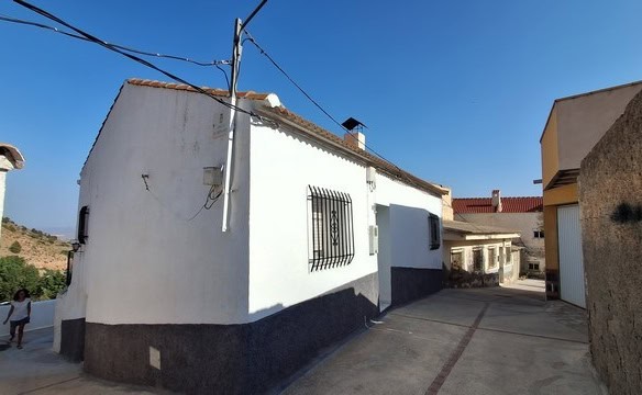 Charming village house in Somontin, Almeria, with white walls and traditional features. Perfect for.