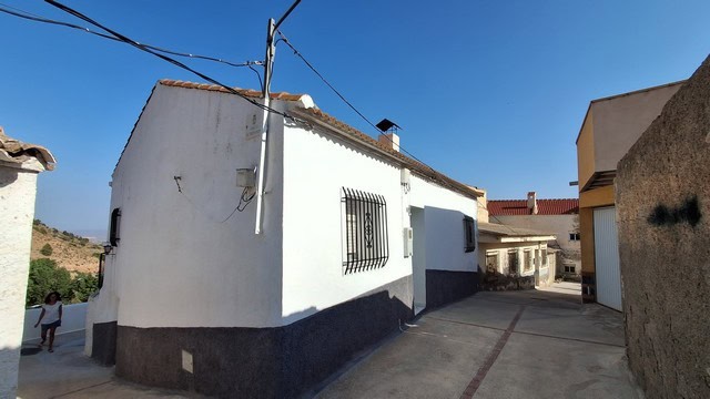 Charming village house in Somontin, Almeria, with white walls and traditional features. Perfect for.