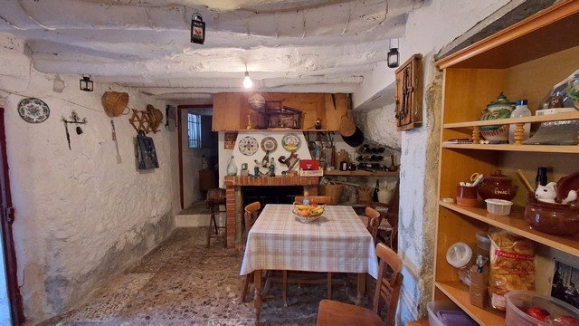 Charming village home interior in Somontin, Almeria with rustic decor and cozy dining area.