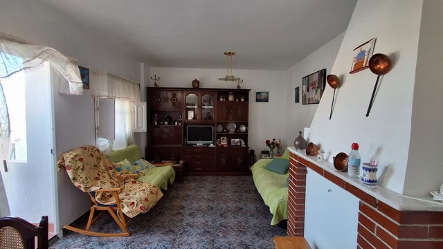 Charming village home interior in Somontin, Almeria, featuring cozy living room with traditional dec.