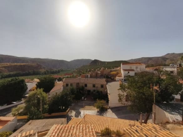 Cave house nestled in the hills of Huesa, Jaen, with scenic mountain views and traditional architect.