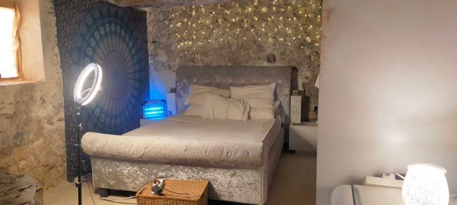 Charming bedroom in a rural property in Seron, Almeria with rustic stone walls and modern decor.