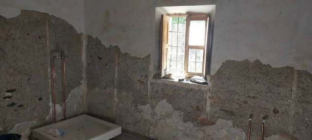 Interior of rural property in Seron, Almeria with unfinished walls and window view.