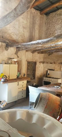 Charming rustic kitchen in a traditional rural property in Seron, Almeria, featuring exposed wooden.