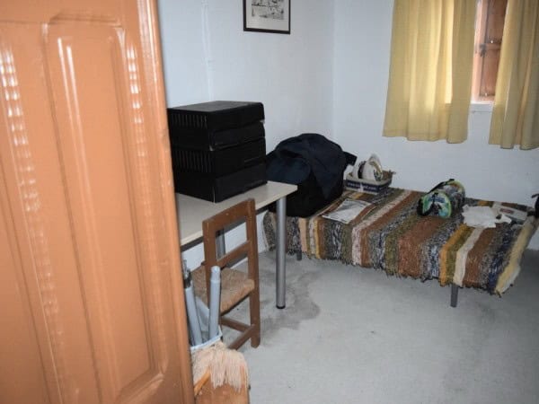 Interior view of a simple farm property bedroom in Baza, Granada, with basic furnishings and natural.