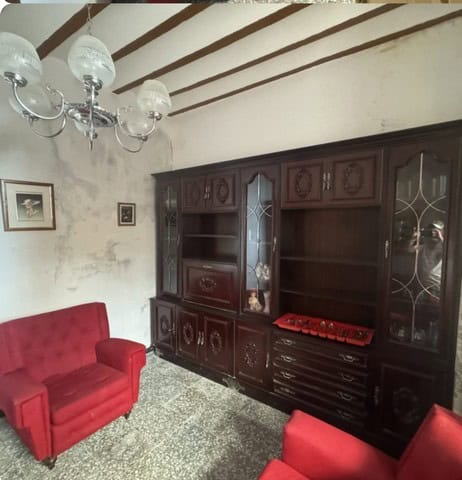 Charming interior of a town house in Purchena, Almeria, featuring vintage furniture and rustic decor.