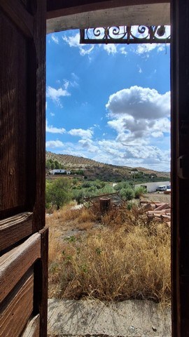 Scenic view of countryside from rustic door in Almeria, Spain.