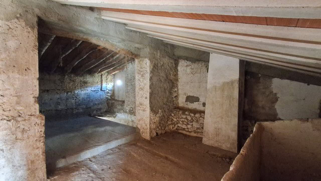Rustic rural property in Albox, Almeria with stone walls and wooden ceiling beams.