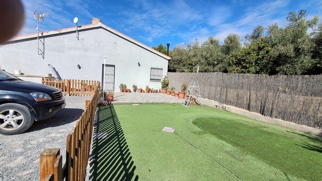 Beautiful villa in Armuna, Almeria featuring a lush garden, parking space, and outdoor area perfect.
