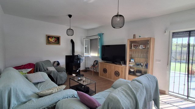 Cozy living room in a villa located in Armuna, Almeria, featuring comfortable seating and modern ame.