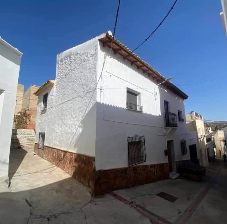 Charming town house in Purchena, Almeria, with traditional white exterior and rustic features.
