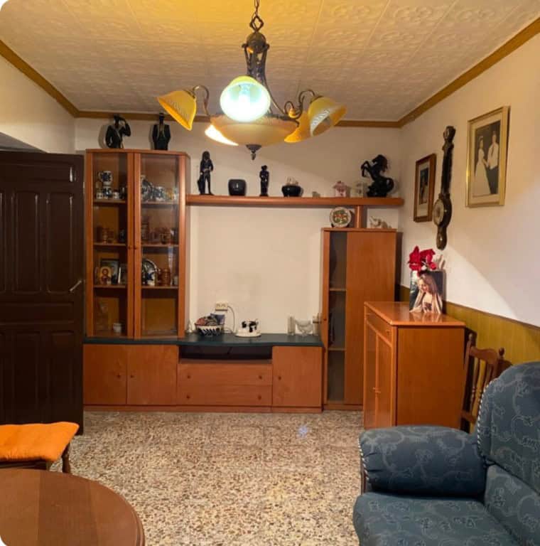 Charming town house living room with wooden furniture, decorative items, and cozy seating in Purchen.