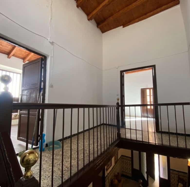 Charming interior of a town house in Purchena, Almeria, featuring a spacious upper floor with wooden.