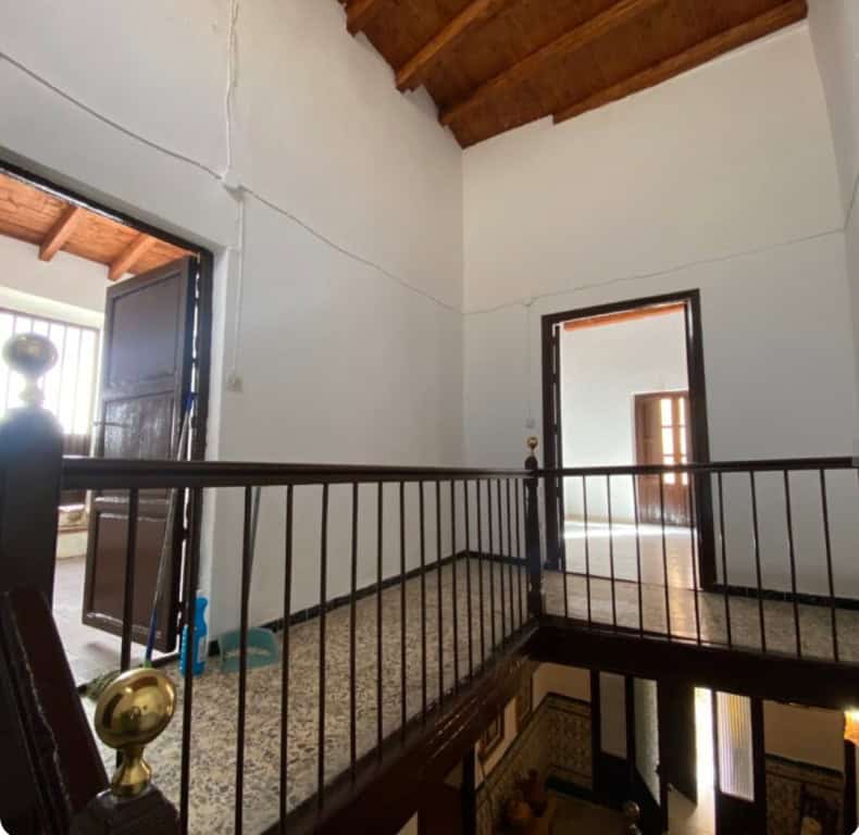 Charming interior of a town house in Purchena, Almeria, featuring a spacious upper floor with wooden.